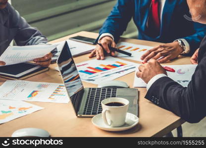 Smart businessman and businesswoman talking discussion in group meeting at office table in a modern office interior. Business collaboration strategic planning and brainstorming of coworkers.