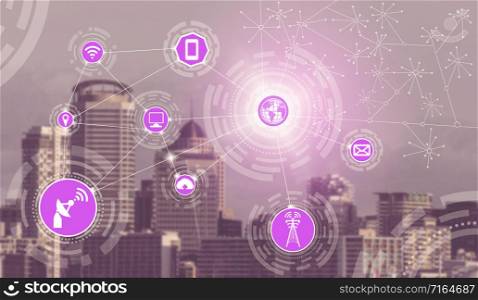 Smart city wireless communication network with graphic showing concept of internet of things ( IOT ) and information communication technology ( ICT ) against modern city buildings in the background.. Smart city and wireless communication network.