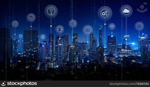 Smart city with smart services and icons, internet of things, networks and augmented reality concept ,Bangkok city night scene.