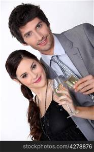 Smart couple drinking champagne