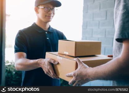 Smart courier making a delivery to a customer at home.