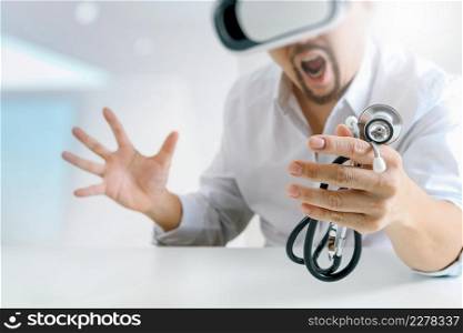 smart doctor wearing virtual reality goggles in modern office with mobile phone using with VR headset