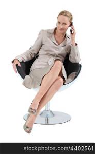 Smart executive woman using a telephone