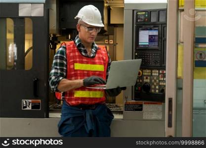 Smart factory worker or engineer do machine job in a manufacturing workshop . Industry and engineering concept .. Smart factory worker or engineer do machine job in a manufacturing workshop