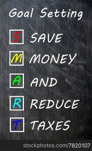 Smart goal setting concept on blackboard for save money and reduce taxes