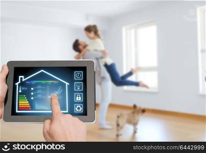 smart home and technology concept - close up of male hands pointing finger to tablet pc computer with house settings on screen and in room background. tablet pc with smart home settings on screen