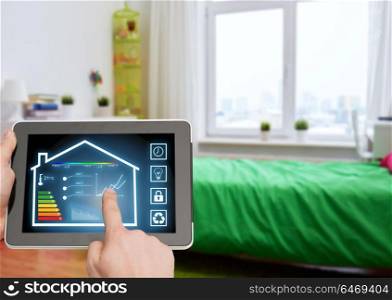 smart home and technology concept - close up of male hands pointing finger to tablet pc computer with house settings on screen over kids room background. tablet pc with smart home settings on screen