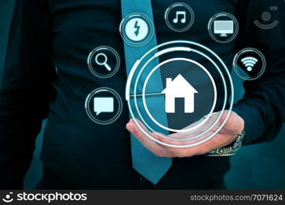 Smart house concept. Artificial intelligence in use in smart homes.intelligent house, and home automation app concept.Businessman with infographic on virtual screen. Smart house concept. Artificial intelligence in use in smart homes.intelligent house, and home automation app concept.