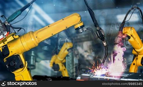 Smart industry robot arms modernization for digital factory technology . Concept of automation manufacturing process of Industry 4.0 or 4th industrial revolution and IOT software control operation .. Smart industry robot arms modernization for digital factory tech
