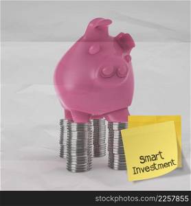 smart investment with sticky note on piggy bank 3d standing over coin as concept
