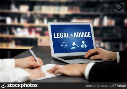 Smart legal advice website for people searching for astute law knowledge in laptop computer on a desk in library of university or college. Smart legal advice website for people searching for astute law knowledge