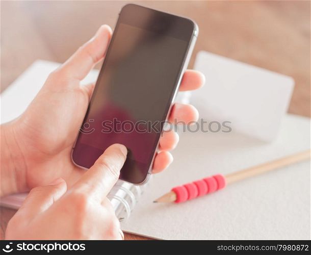 Smart phone in a woman&rsquo;s hand, stock photo