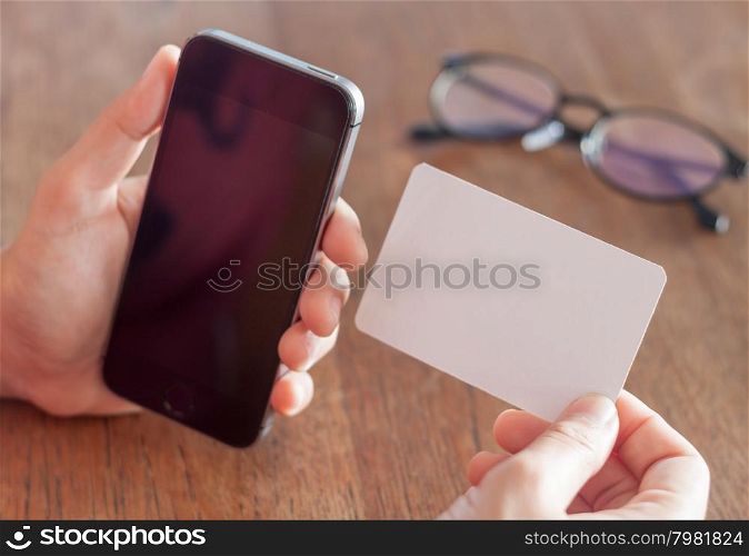 Smart phone in a woman&rsquo;s hand, stock photo