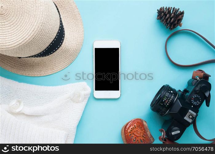 Smart phone mock up with woman accessories and camera for app presentation. View from above
