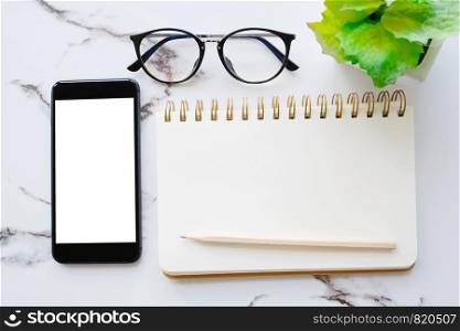 Smart phone with blank screen and blank notebook paper background, mock up, flat lay