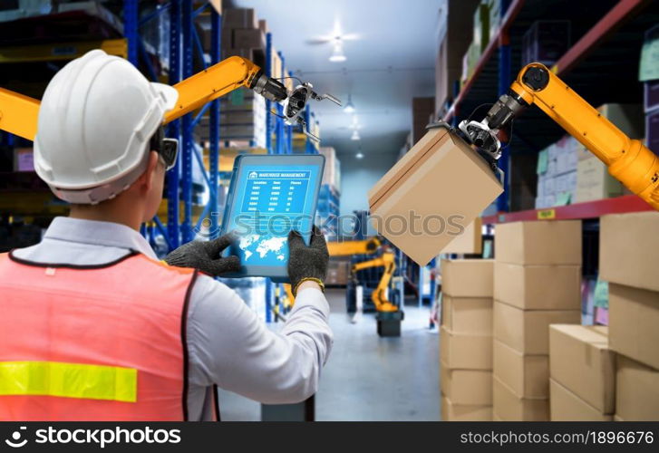 Smart robot arm systems for innovative warehouse and factory digital technology . Automation manufacturing robot controlled by industry engineering using IOT software connected to internet network .. Smart robot arm systems for innovative warehouse and factory digital technology