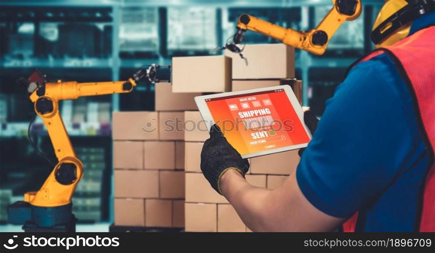 Smart robot arm systems for innovative warehouse and factory digital technology . Automation manufacturing robot controlled by industry engineering using IOT software connected to internet network .. Smart robot arm systems for innovative warehouse and factory digital technology