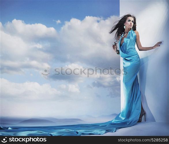 Smart, sensual woman wearing long, turquoise gown