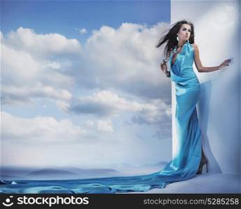 Smart, sensual woman wearing long, turquoise gown