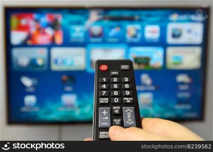 Smart tv and hand hold the remote control