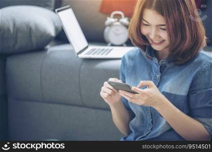 Smart Woman Explore Online Shopping Website on smartphone. Smiling face of asian woman holding cellphone with E-commerce Shopping online website Reading Online Article, Blog and vlog.