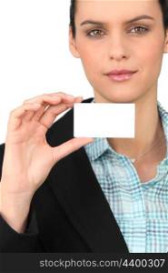 Smart woman holding a blank business card