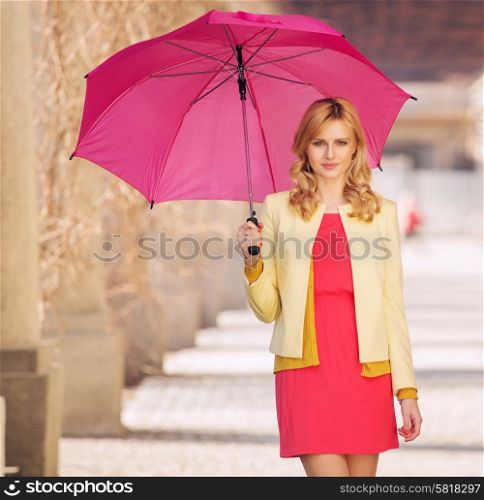 Smart woman waling with the umbrella