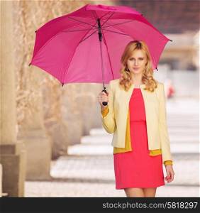 Smart woman waling with the umbrella