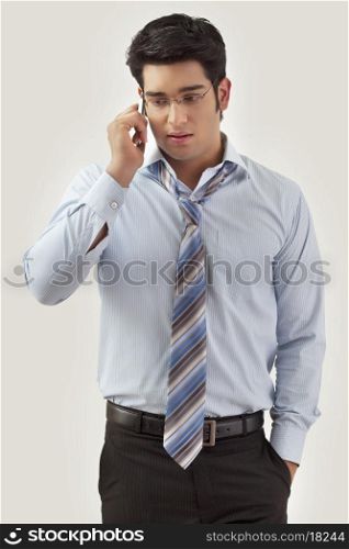 Smart young man talking on mobile phone