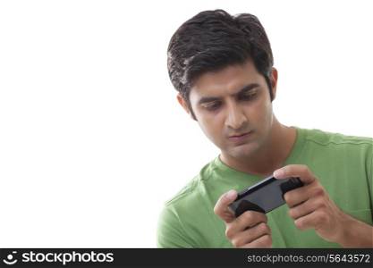 Smart young man using mobile phone over white background