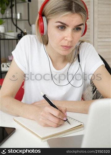 smart young student wearing red headphones