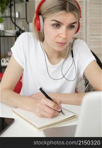 smart young student wearing red headphones
