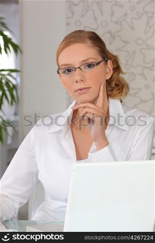 Smart young woman at a laptop computer