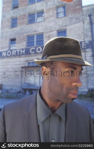 Smartly Dressed Man in Front of Old Building