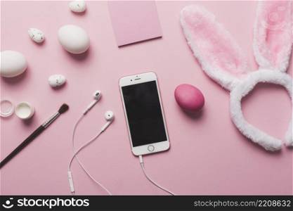 smartphone amidst easter supplies