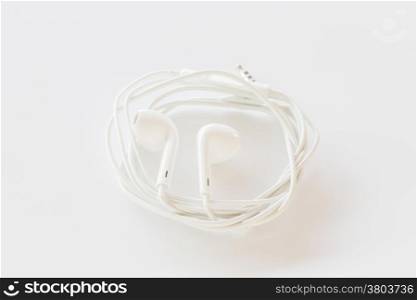 Smartphone ear buds isolated on white background, stock photo