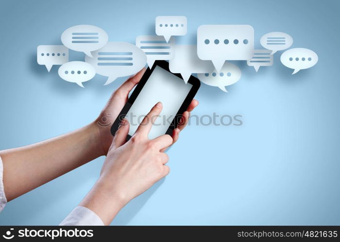 Smartphone in hand. Close-up image of human hands holding smartphone