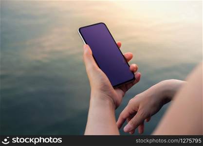 Smartphone Mockup Image. Display Screen is Clipping Path. Woman using Mobile Phone