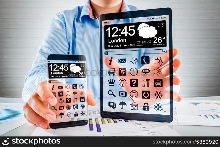 Smartphone (phablet) and tablet with a transparent display in human hands. Concept actual future innovative ideas and best technologies humanity.