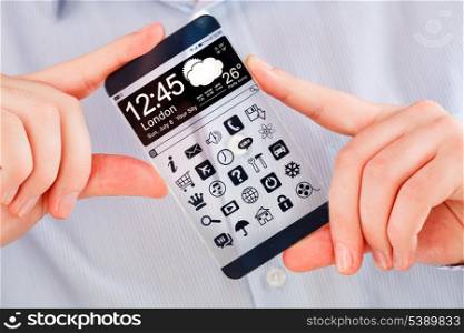 Smartphone (phablet) with a transparent display in human hands. Concept actual future innovative ideas and best technologies humanity.