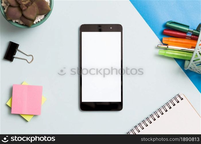 smartphone surrounded by office supplies. Resolution and high quality beautiful photo. smartphone surrounded by office supplies. High quality and resolution beautiful photo concept