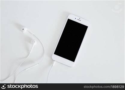 smartphone with earphone isolated white background. Resolution and high quality beautiful photo. smartphone with earphone isolated white background. High quality beautiful photo concept
