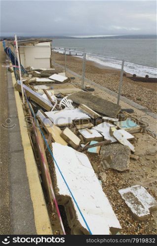 Smashed by storms, damaged beach huts. After the February 14 2014 Valentine?s Day Storm, Milford on Sea, Hampshire, England, UK