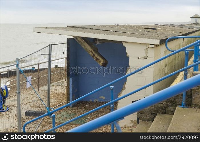 Smashed by storms, damaged beach huts. After the February 14 2014 Valentine?s Day Storm, Milford on Sea, Hampshire, England, UK
