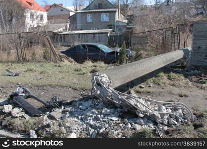 Smashed car in ditch and toppled pillar on-site accidents