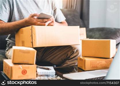 SME freelance man working with packaging startup entrepreneur small business owner at home,Online business seller packaging and delivery concept