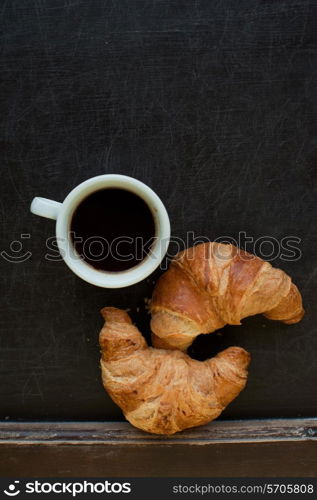 smile coffee with croissant at board