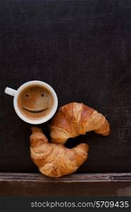 smile coffee with croissant at board