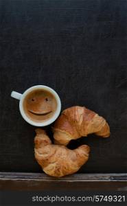 smile coffee with croissant at board. smile coffee