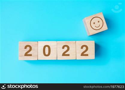 Smile face block with 2022 text on blue background. Satisfaction, feedback, Review and New Year concepts